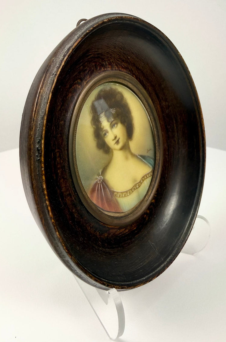 Side view of ebonized wooden frame holding Madame Récamier miniature portrait on acrylic stand