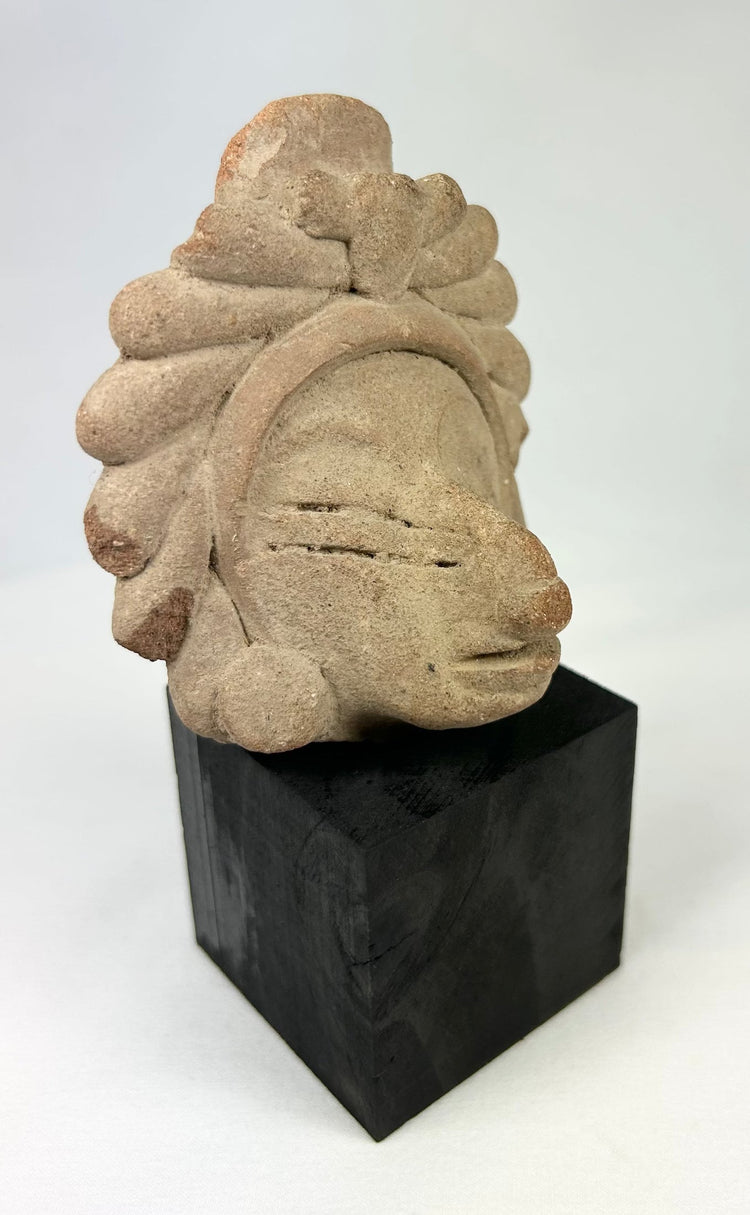 Javanese Majapahit temple fragment, Kala Simha guardian head carving with stylized radiating mane