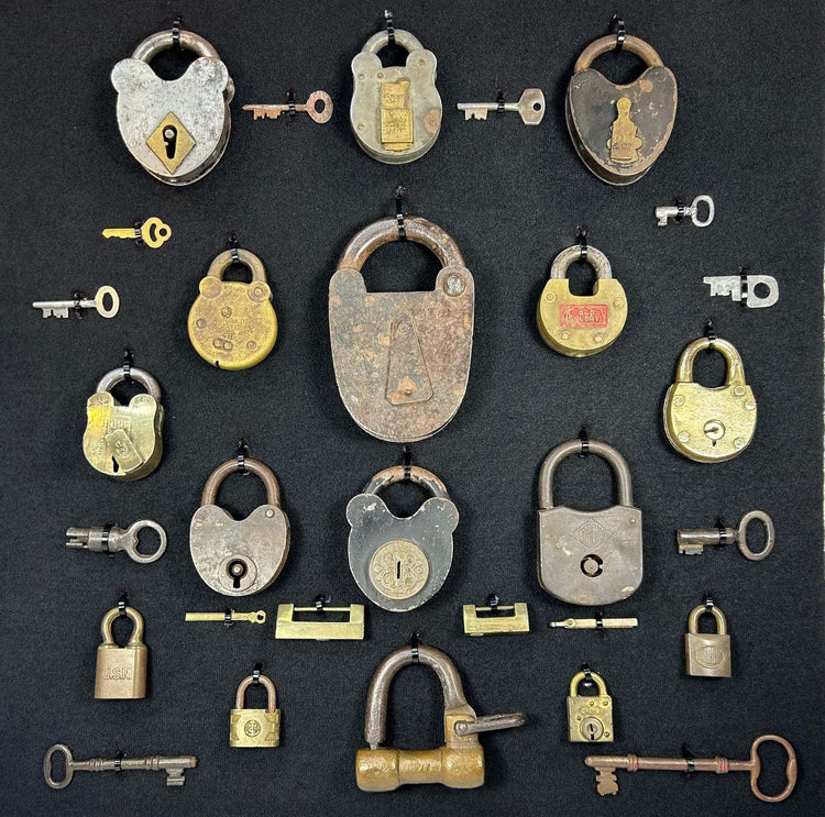 Framed industrial collection of antique locks with brass and iron examples