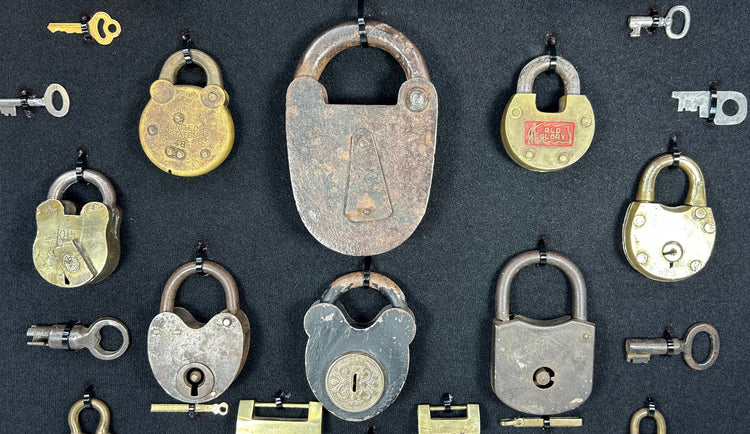 Antique locks and keys display with varied padlock styles and patina