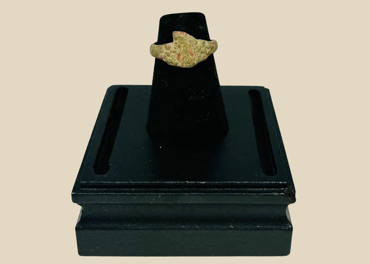 Ancient bronze ring from the Mediterranean or Middle East, 1st–5th century CE, with a bold bezel, natural patina, and simple, elegant design.