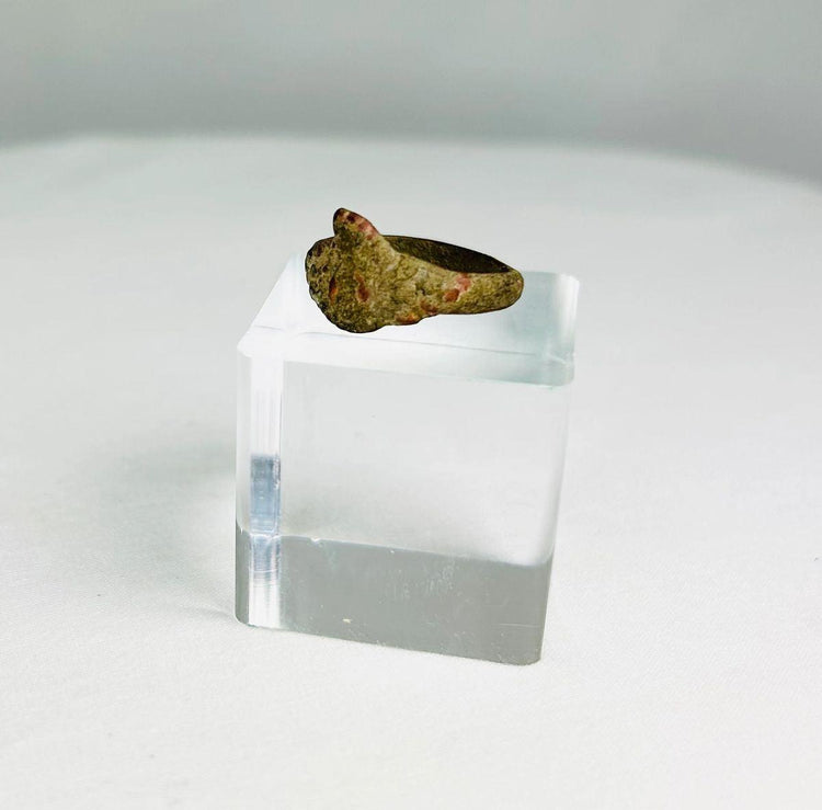 Ancient bronze ring from the Mediterranean or Middle East, 1st–5th century CE, with a bold bezel, natural patina, and simple, elegant design.