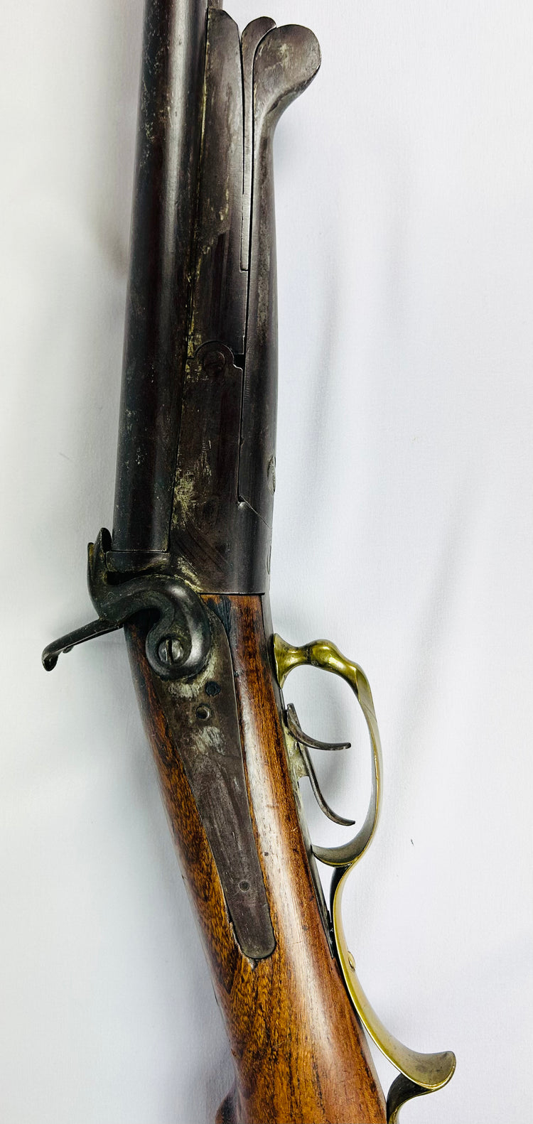 Antique French underlever double-barrel shotgun, 16 bore, mid-19th century, pinfire ignition system, walnut stock with brass trigger guard, non-functional collector’s piece