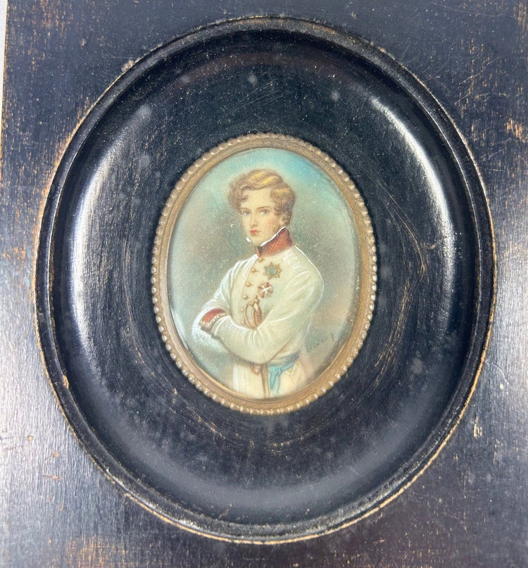 Close-up of Habsburg officer miniature portrait in white uniform with red collar and blue sash, set in brass bezel