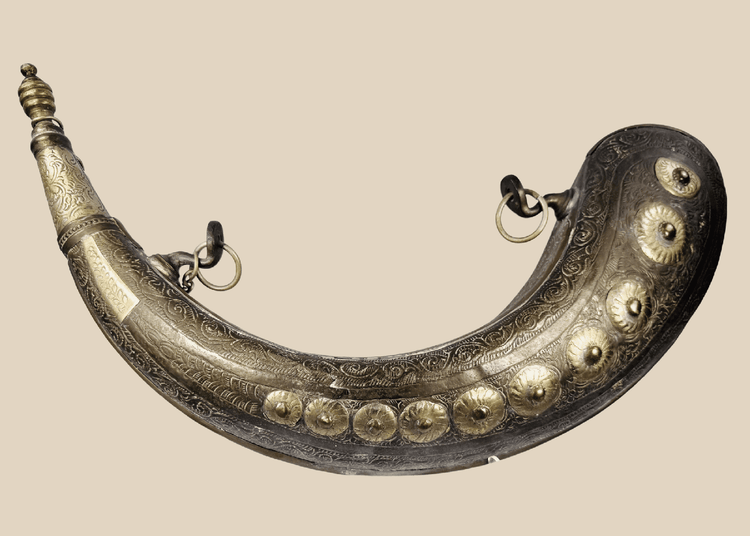 Antique Moroccan brass powder horn with crescent-shaped body and engraved floral decoration