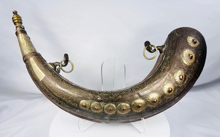 North African copper-alloy powder flask with ten raised floral bosses
