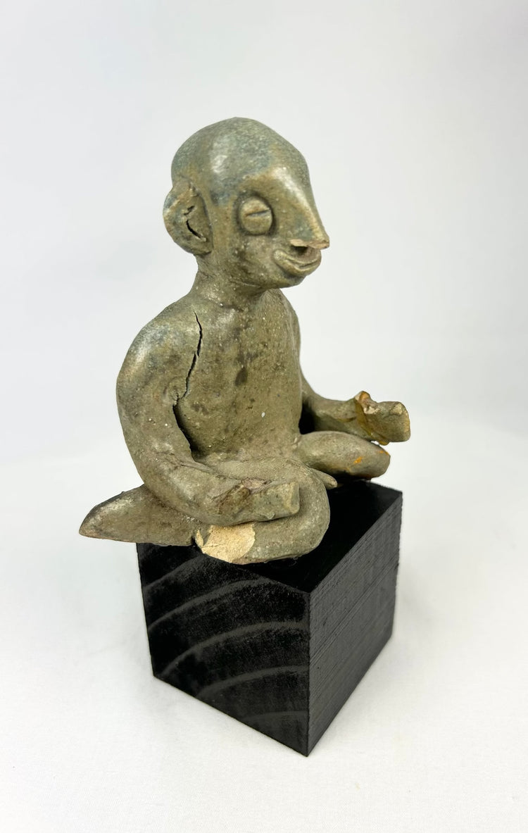 West Mexican Chinesco seated male figure with traces of red pigment and burial patina