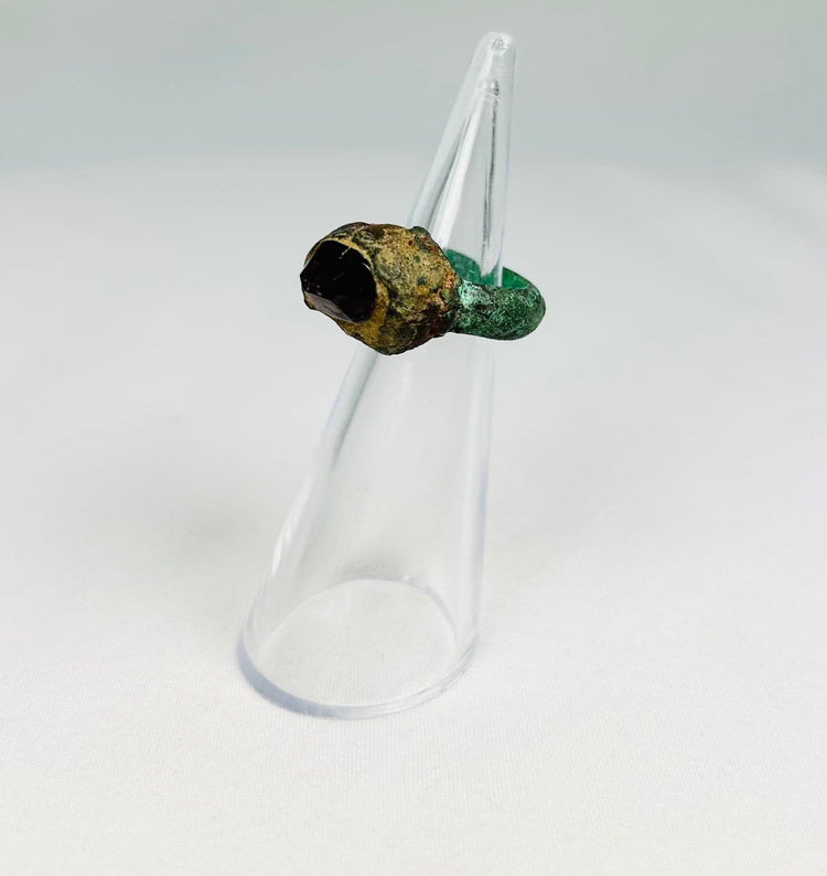 9th–7th century BCE Assyrian bronze ring with raised gemstone bezel