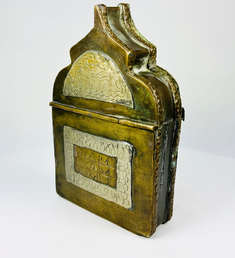 Antique North African amulet box with pointed arch lid, carved bone detailing and devotional wear.