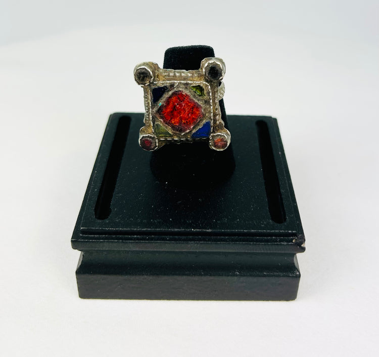 19th–early 20th century North African or Middle Eastern hand-forged silver ring with bold rectangular bezel, geometric incised motifs, thick shank, and rich patina, traditional tribal or Ottoman-influenced jewelry