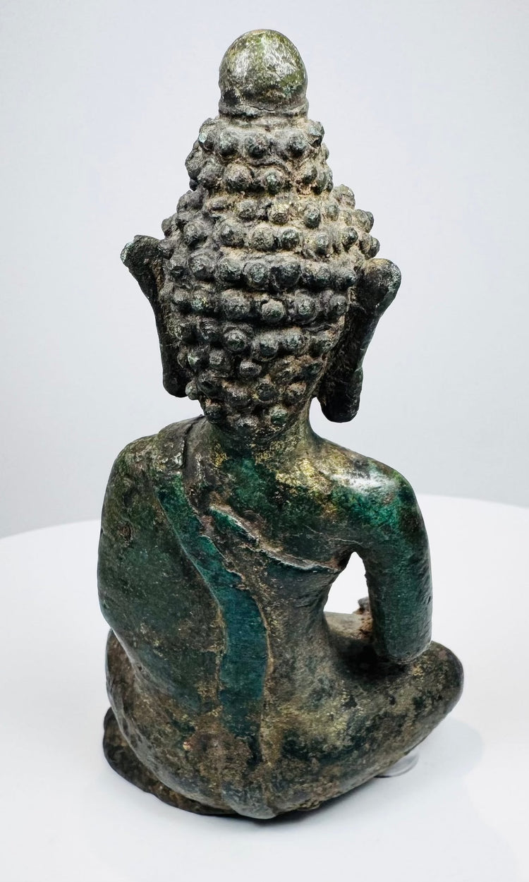 Rear view of the Lan Na Buddha showing tiered snail-shell hair curls