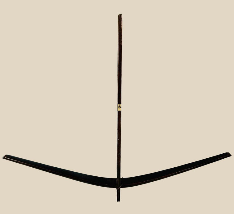 Antique Nu tribal crossbow from Yunnan, China, crafted from mulberry wood with hand-carved bone toggles and aged patina, dating to the Late Qing to early 20th century.