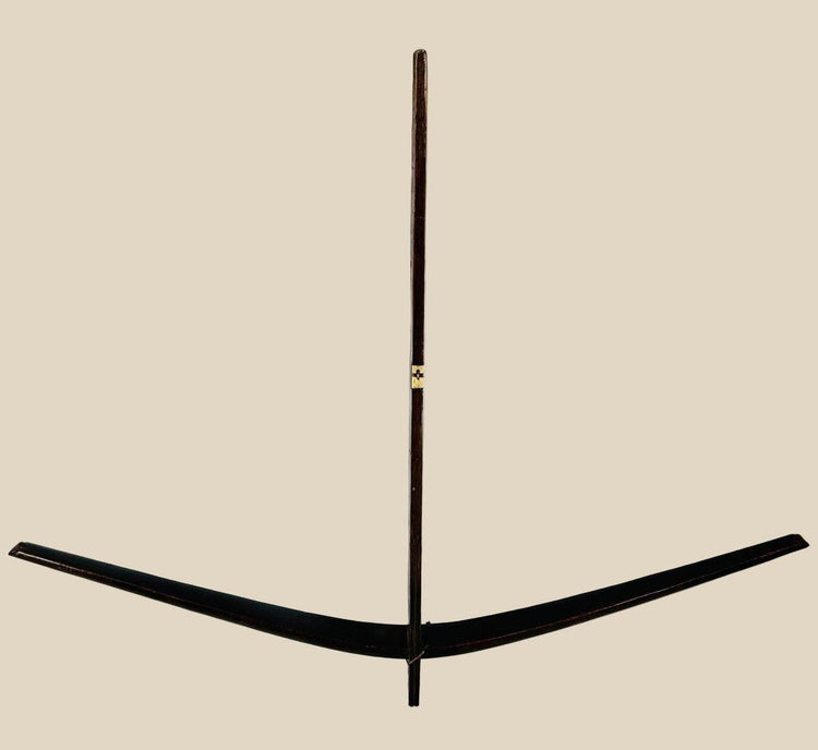 Antique Nu tribal crossbow from Yunnan, China, crafted from mulberry wood with hand-carved bone toggles and aged patina, dating to the Late Qing to early 20th century.