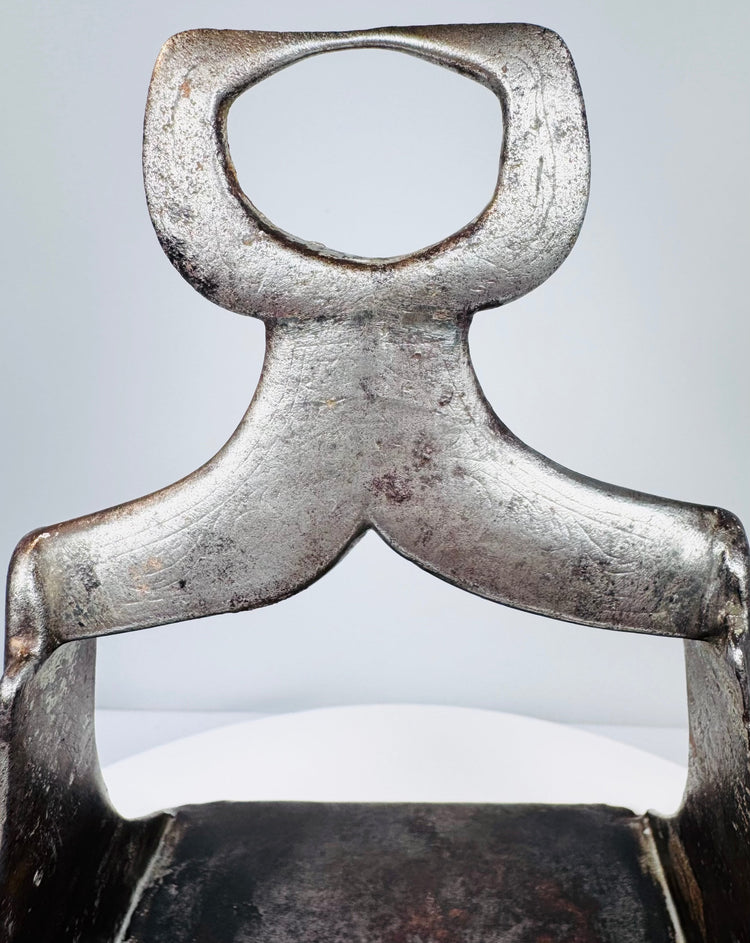 Ottoman military stirrup from the 1600s with floral openwork footplate and decorative silver damascene remnants.