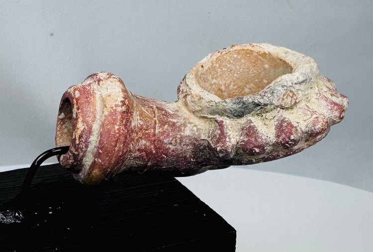 Moulded terracotta tobacco bowl with floral profile and archaeological patina