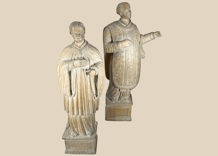 Pair of antique hand-carved European religious figures depicting saintly and ecclesiastical subjects.