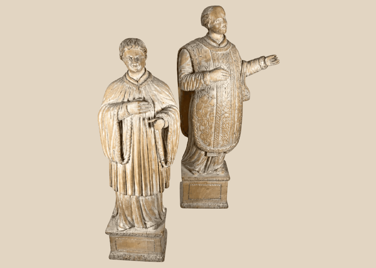 Pair of antique hand-carved European religious figures depicting saintly and ecclesiastical subjects.
