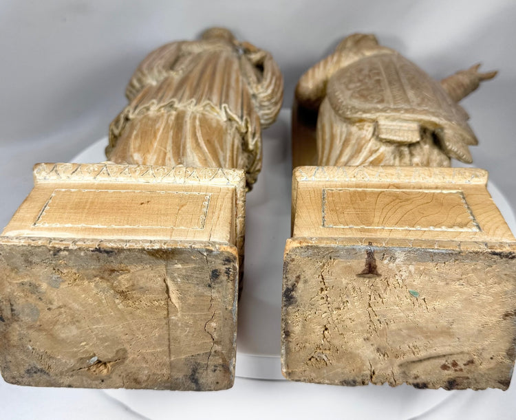 Pair of antique Christian sculptures carved from hardwood and retaining a natural aged finish.