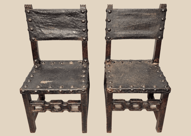 Pair of 17th-century Spanish Baroque walnut side chairs with leather upholstery