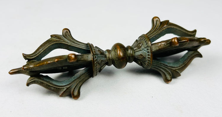 Pair of Tibetan Buddhist ritual objects in cast bronze