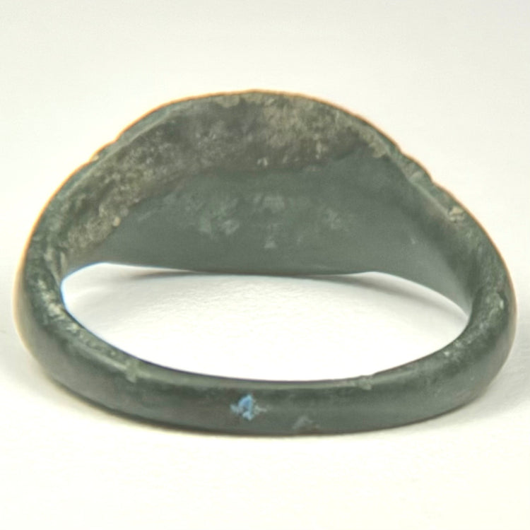 Roman Imperial bronze ring displaying dark olive and black patina with lighter green mineralization
