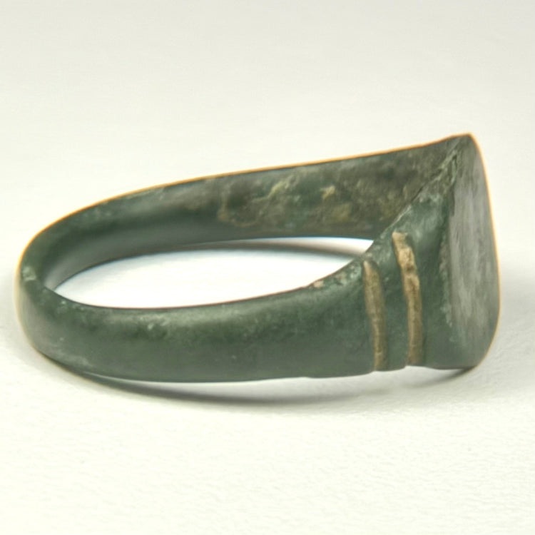 Underside of Roman bronze finger ring with complete rounded hoop and naturally aged archaeological surface