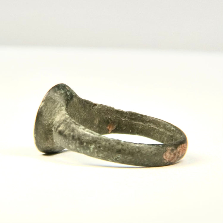 Ancient Eastern Mediterranean bronze ring showing irregular hand-finished hoop and naturally developed archaeological patina