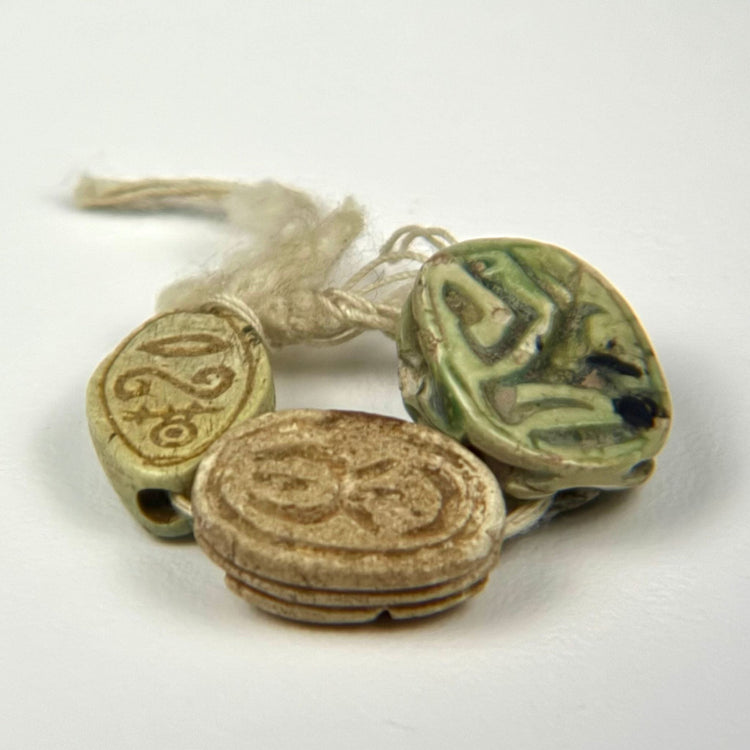 Ancient Egyptian scarab amulet group dating circa 600–200 BCE, representing rebirth, regeneration, and spiritual protection.