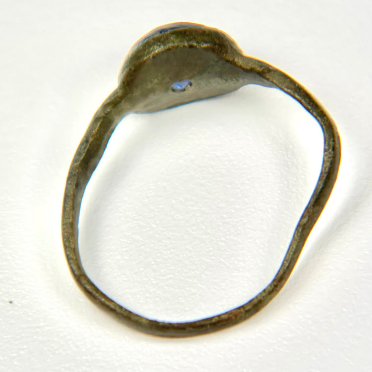 Roman Imperial bronze finger ring with cobalt blue glass stone