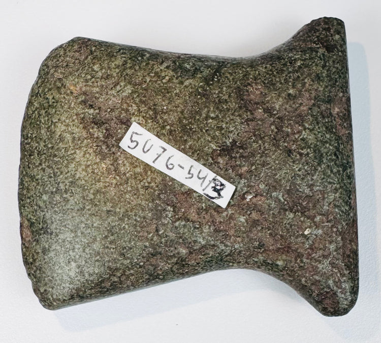 Small ancient Andean stone axe circa 500–1500 CE with notched sides, use-worn cutting edge, and original archaeological tag.
