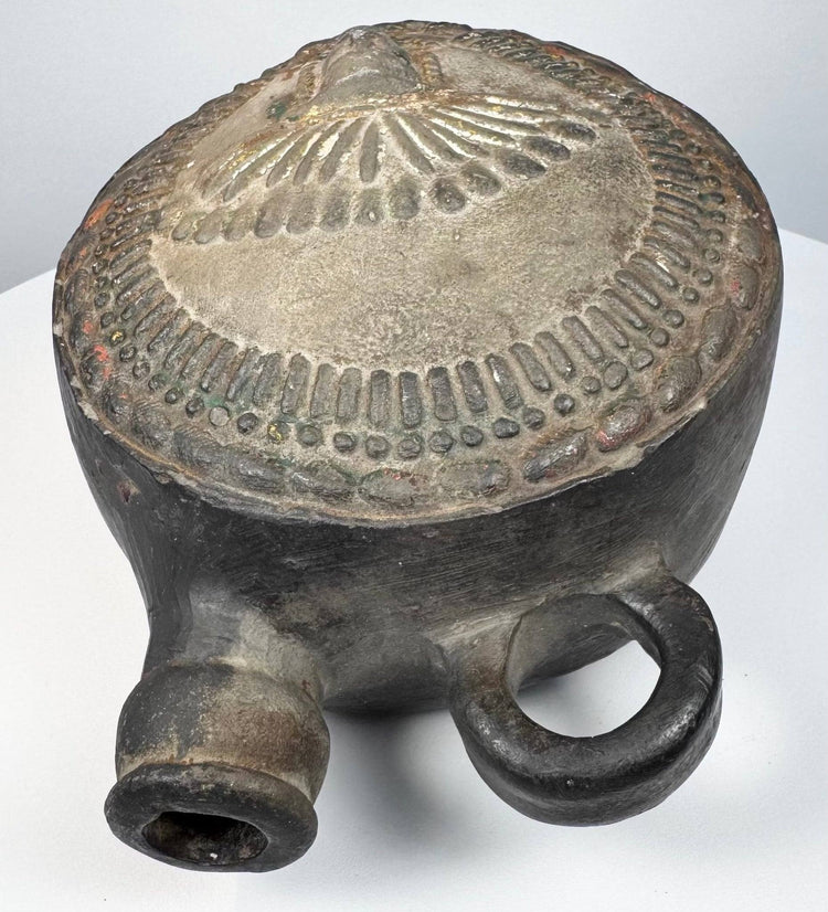 Andean pottery vessel with elaborate headdress imagery and tubular spout