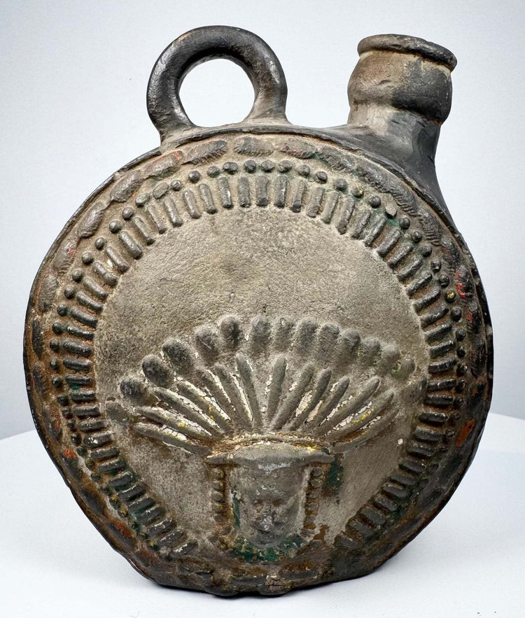Ancient Peruvian pottery flask with radiating headdress and stepped geometric border