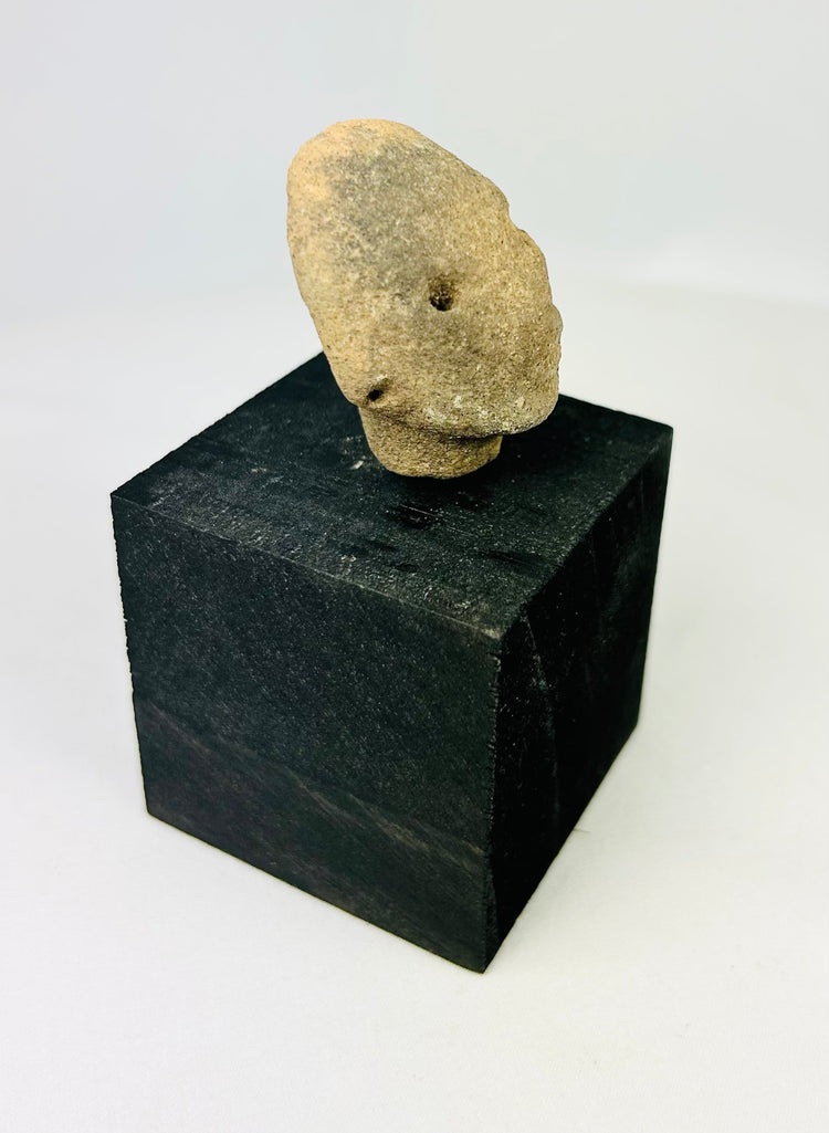 Pre-Columbian terracotta head fragment, West Mexico, drilled eyes, rounded features, Nayarit or Jalisco, 300 BCE–300 CE