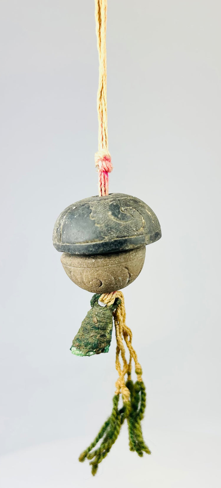 Detailed upper section showing twisted cord attachment and aged fiber condition