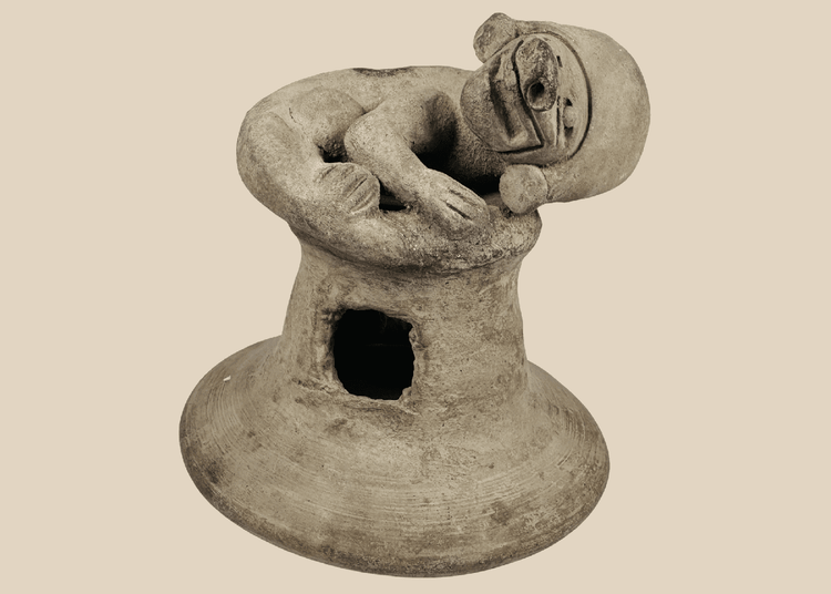 Pre-Columbian Manteño terracotta incensario from coastal Ecuador featuring a recumbent anthropomorphic figure and ceremonial vent openings.