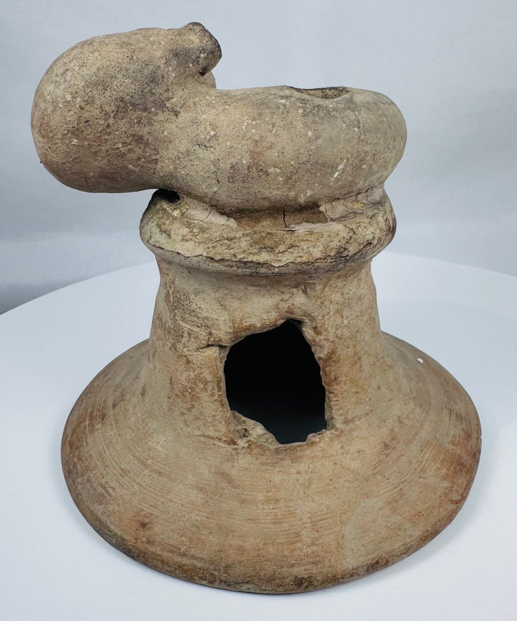 Pre-Columbian terracotta incensario from Ecuador with expressive anthropomorphic sculpture and weathered archaeological surface.
