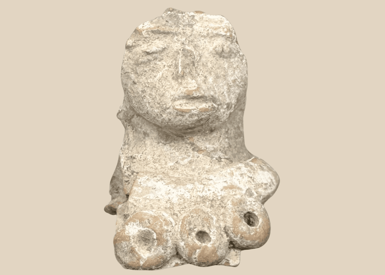 Pre-Columbian terracotta female figure fragment with prominent headdress and stylized facial features, Mesoamerica, circa 300 BCE–600 CE.