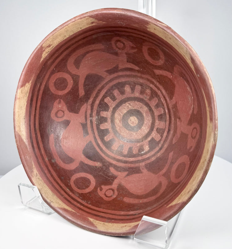 Nariño culture ceremonial pottery bowl with intricate negative resist designs, bichrome coloring, and monkey motifs.
