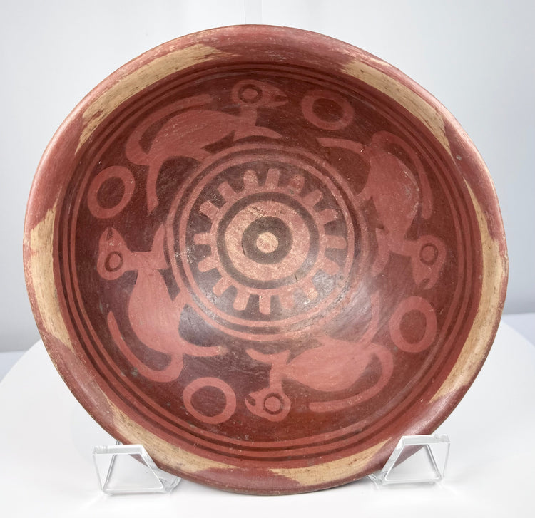 Ancient Colombian or Ecuadorian Nariño bowl with hand-painted geometric motifs and distinctive animal iconography.