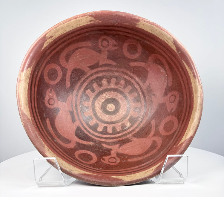 Historic Nariño pottery bowl from northern South America displaying detailed bichrome surface decoration and aged patina.