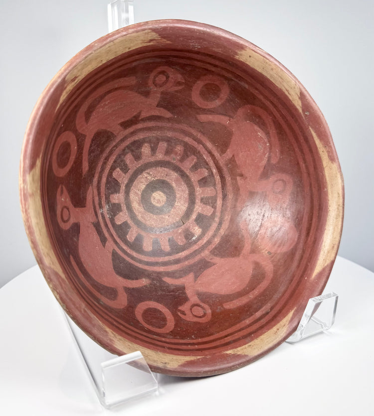 Pre-Columbian terracotta bowl circa 800–1500 CE showing its rounded foot, aged clay surface, and preserved decoration.