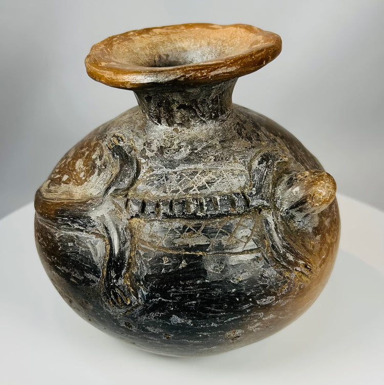 Ancient Costa Rican ceramic vessel with crocodilian motifs and patina