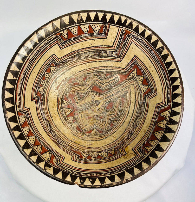Macro image capturing pigment layering and surface texture on ancient Costa Rican ceremonial bowl.