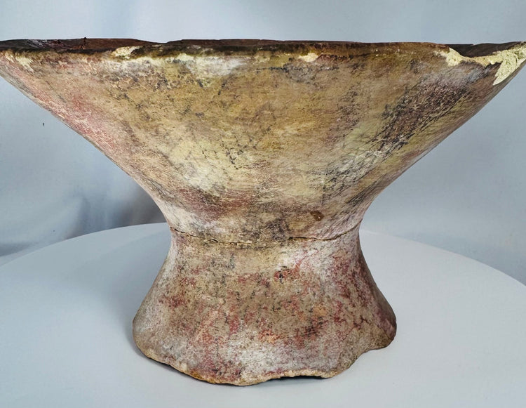 Pre-Columbian pottery pedestal bowl with geometric interior motifs and weathered excavated appearance.