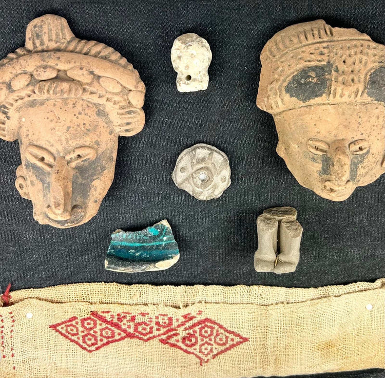 Pre-Columbian terracotta fragments and red geometric textile, framed in shadowbox for display