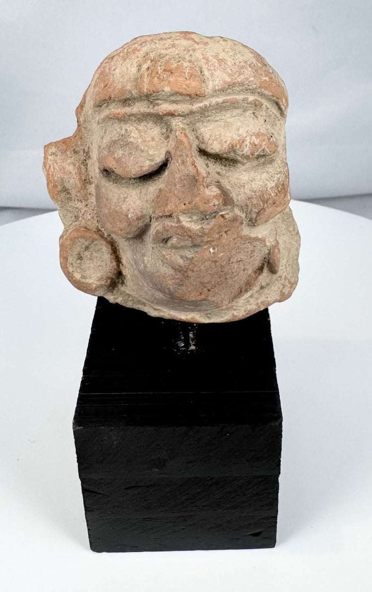 Weathered Pre-Columbian terracotta head fragment with burial accretions and surface patina