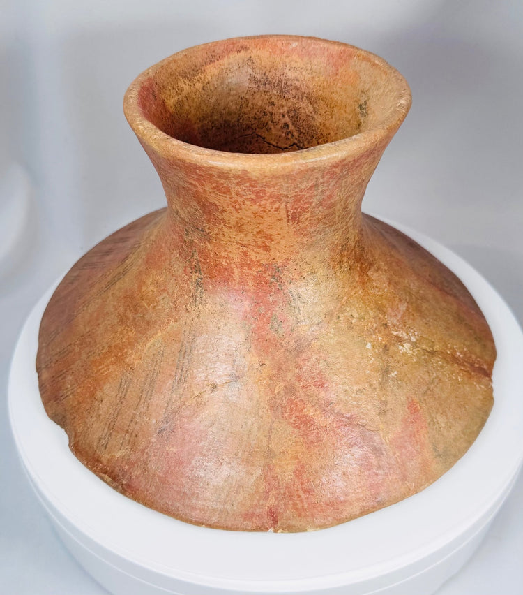 Handcrafted ancient American terracotta vessel with elevated base and ritual ceremonial character