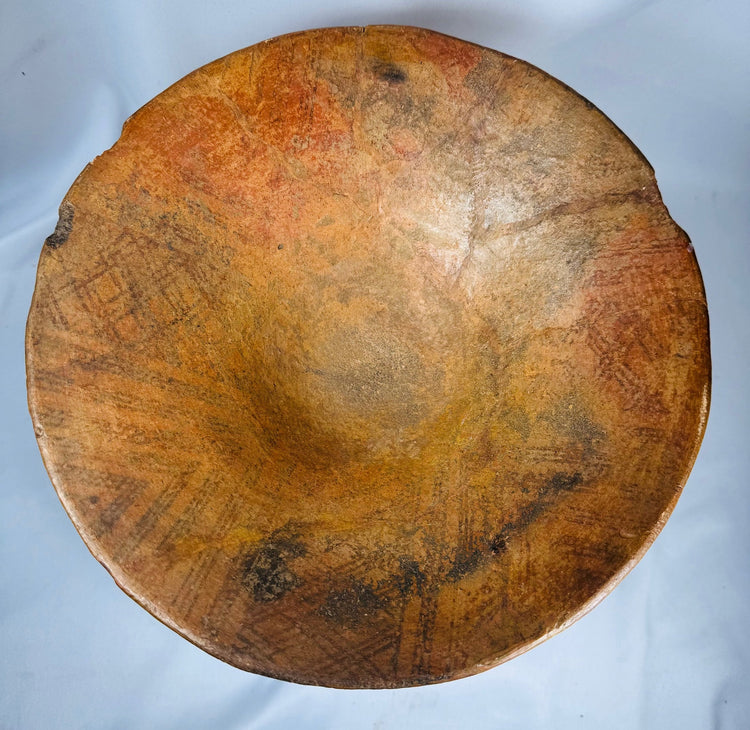 Ancient earthenware pedestal vessel displaying geometric banding and ceremonial presentation form