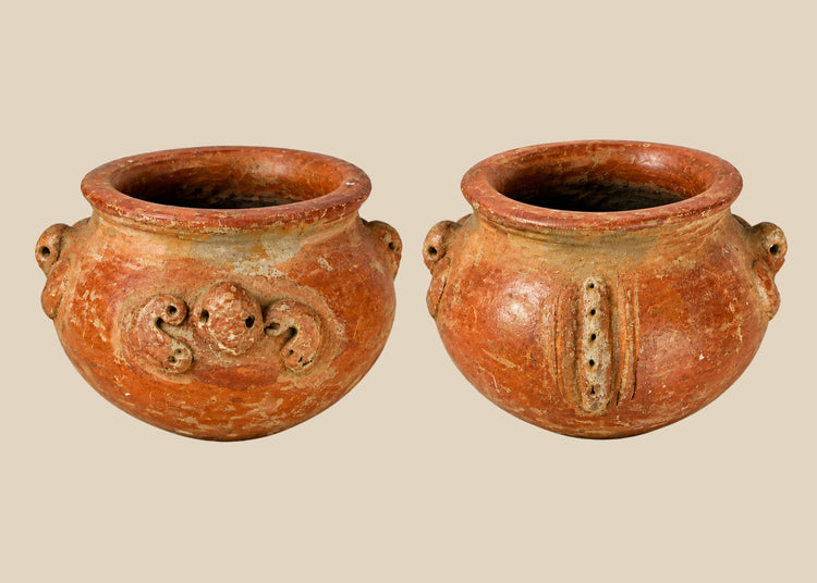 A late Pre-Columbian terracotta vessel with sculpted handles, ornamental motifs, and earthy red patina, dating to circa 1000–1500 CE.