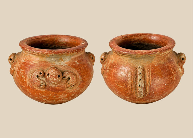 A late Pre-Columbian terracotta vessel with sculpted handles, ornamental motifs, and earthy red patina, dating to circa 1000–1500 CE.